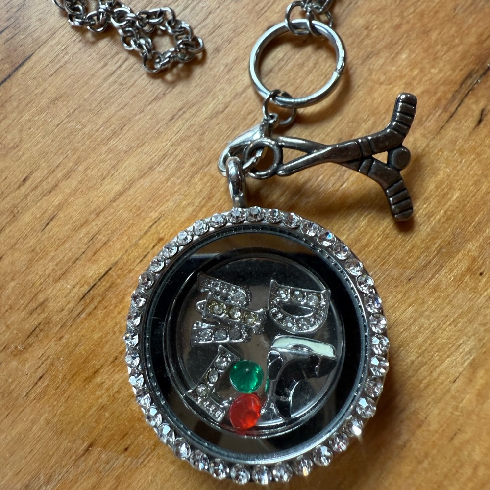 Silver Minnesota Wild Hockey team silver pendant..